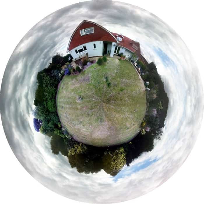 A mini globe panorama of a house and garden compact in a circular shape 