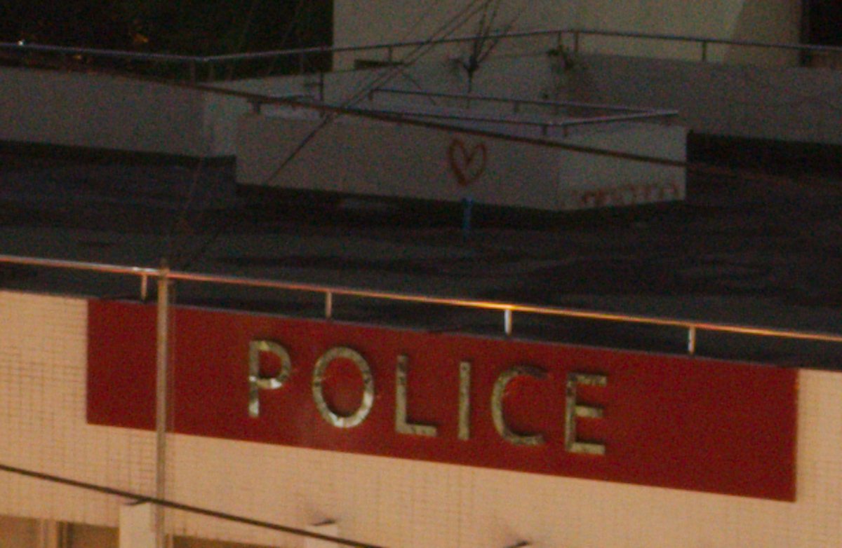 Unedited image of rooftop and police sign in AfterShot Pro 3