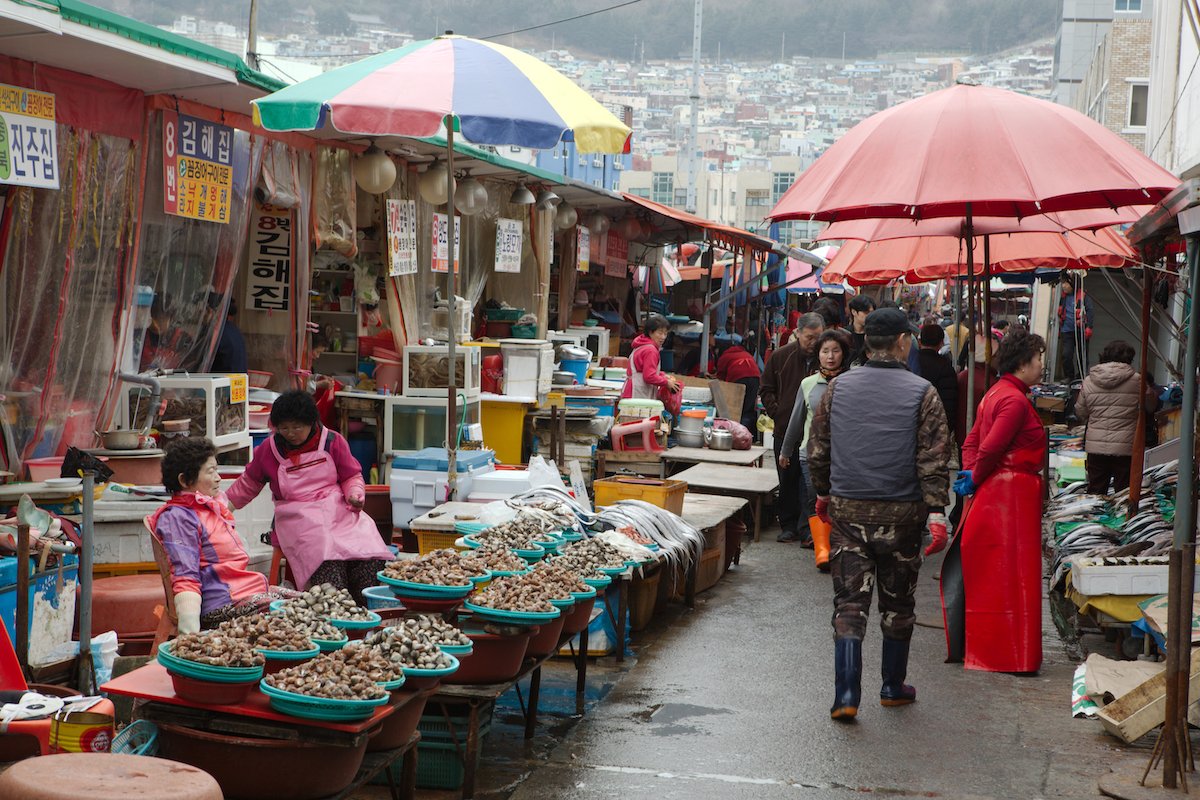 RAW image of a South Korean outdoor marketplace with people