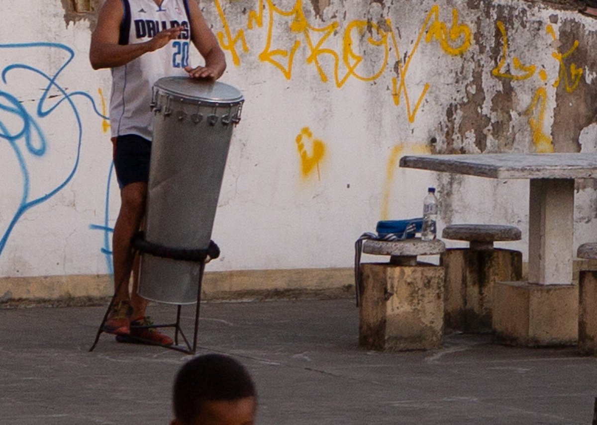 Cropped image of a person playing steel drums in Adobe Lightroom