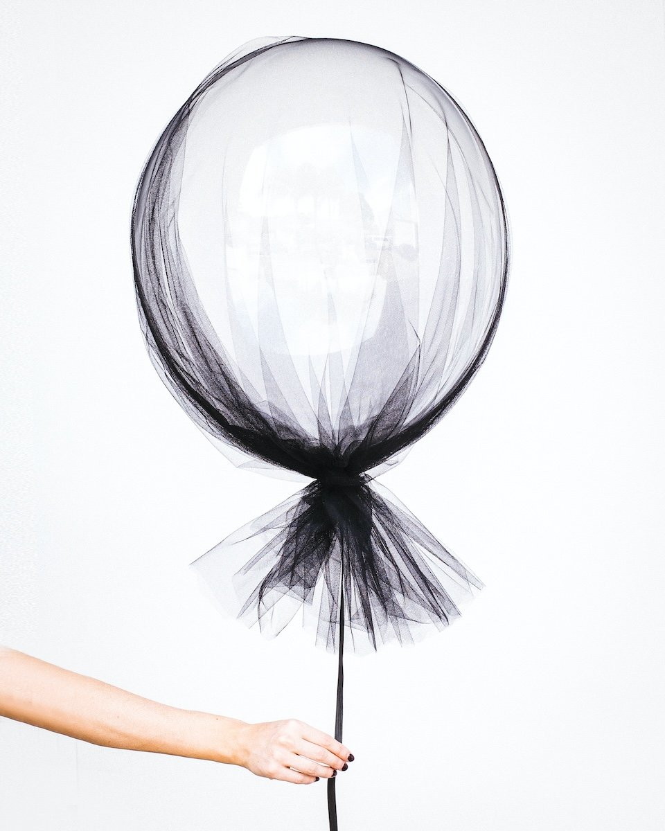 A white balloon covered with fabric as a DIY photography prop