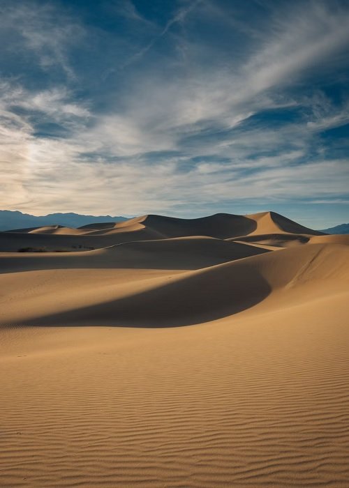Undulating sand dunes in a desert