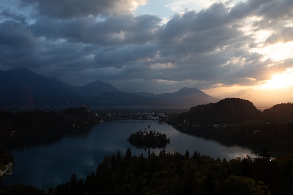 RAW travel landscape image with mountains, a lake, and trees