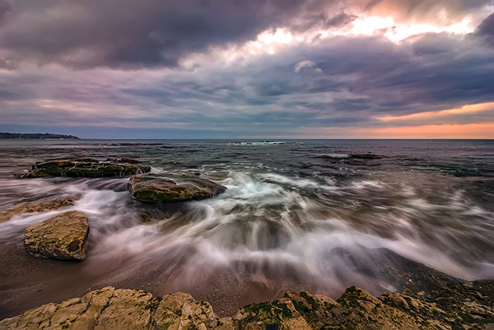 Amazing long exposure seascape with motion blur and flowing wave.