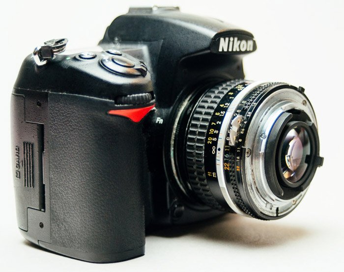 A Nikon DSLR camera with a reversed lens for macro Photography