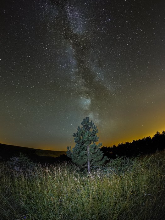 Stunning photo of the milky way over a landscape at night