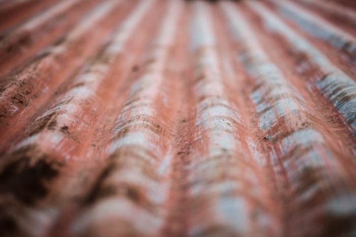 Abstract close up photograph of a sheet of corrugated metal 