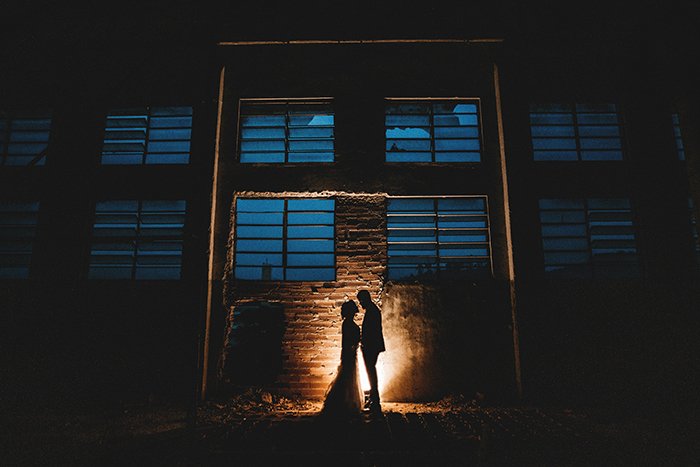 A silhouette of a bride and groom 